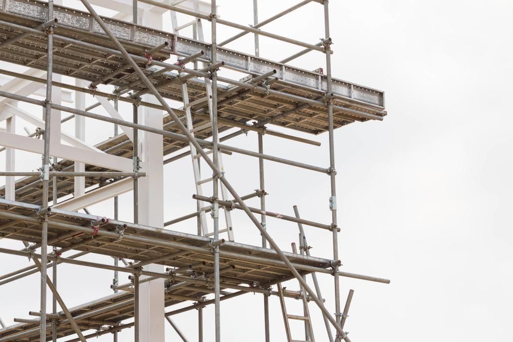 A Row of Scaffolding Is Sitting on Top of A Building — Lennox Head Scaffolding in Byron Bay, NSW