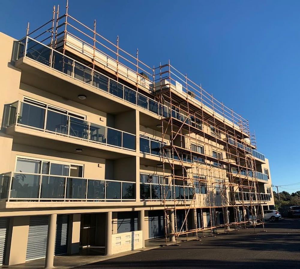 A Large Building With Scaffolding on the Top of It — Lennox Head Scaffolding in Kinvara, NSW