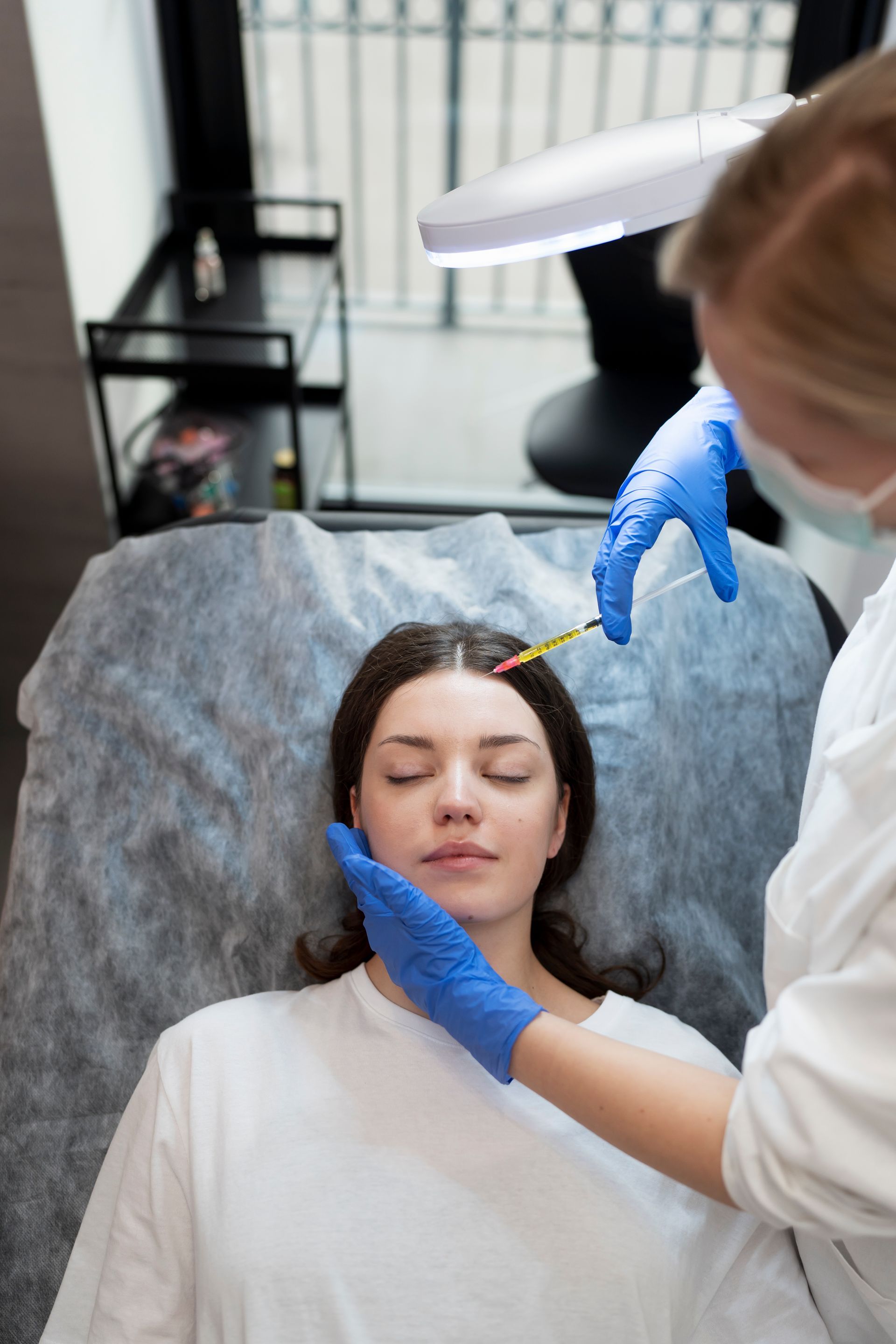 a woman getting a prp treatment