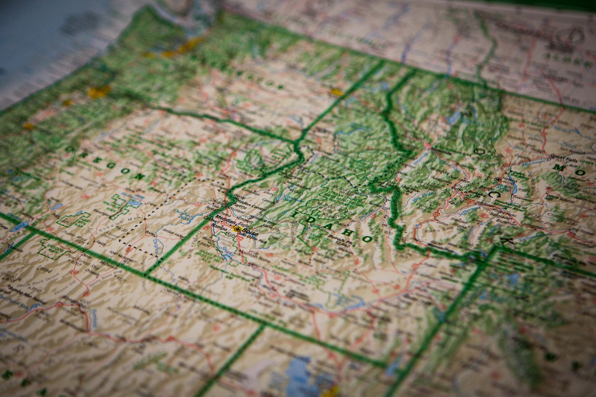 A close up of a map of the united states on a table.