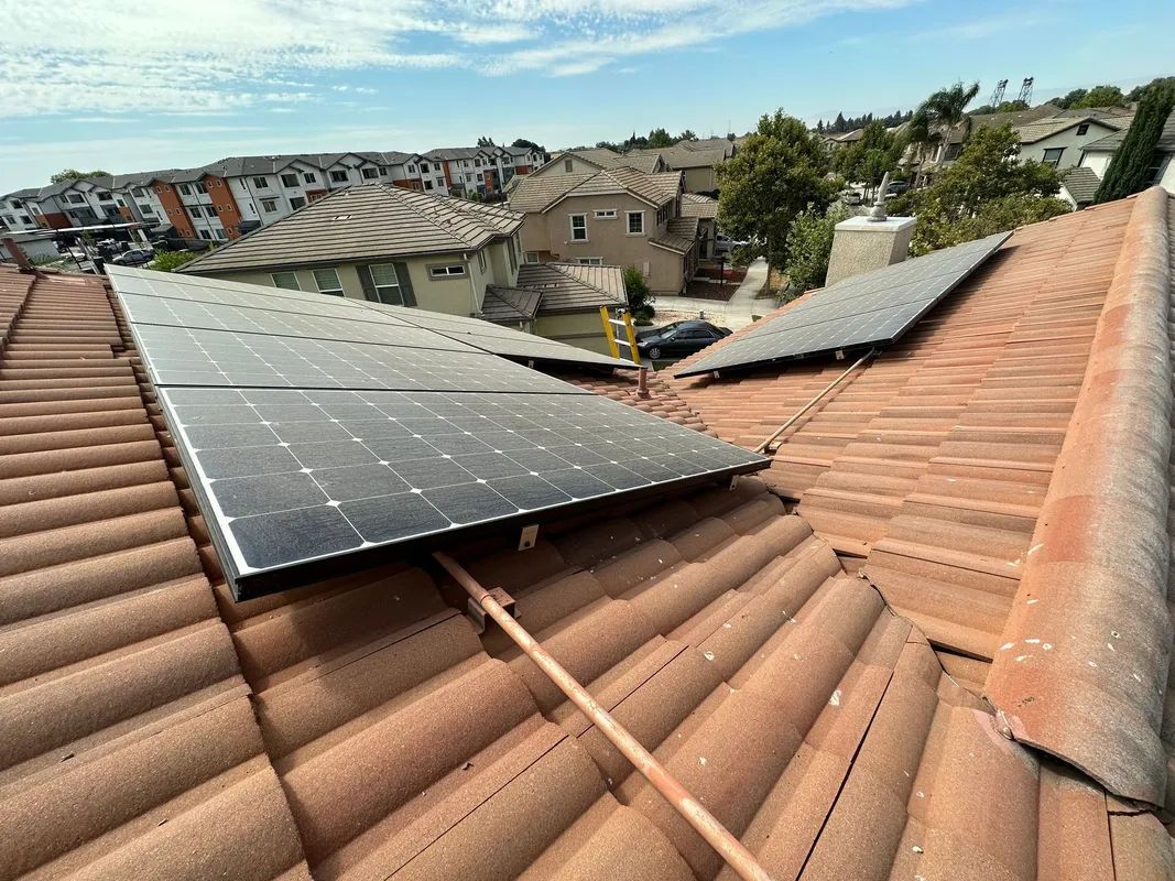 A roof with a lot of solar panels on it