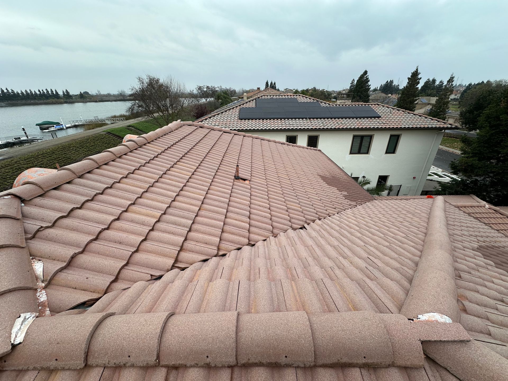 A house with a tiled roof and solar panels on it