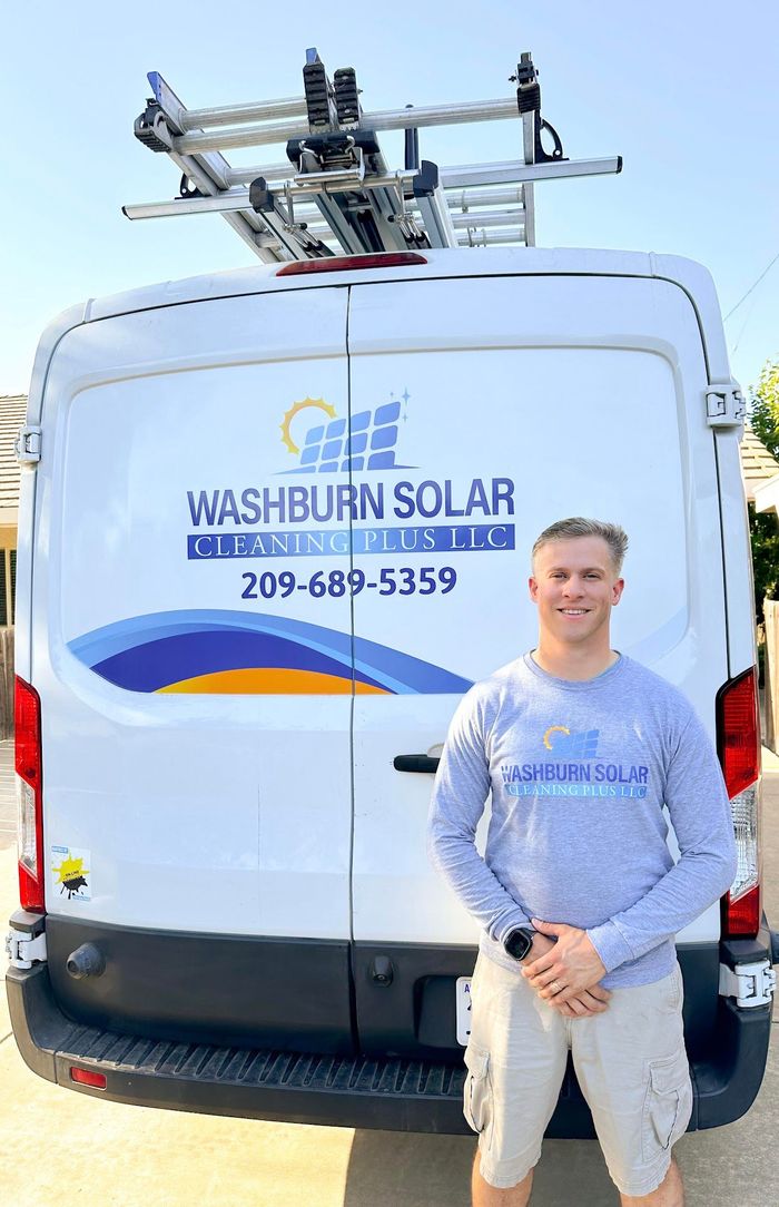 A man is standing in front of a white van.