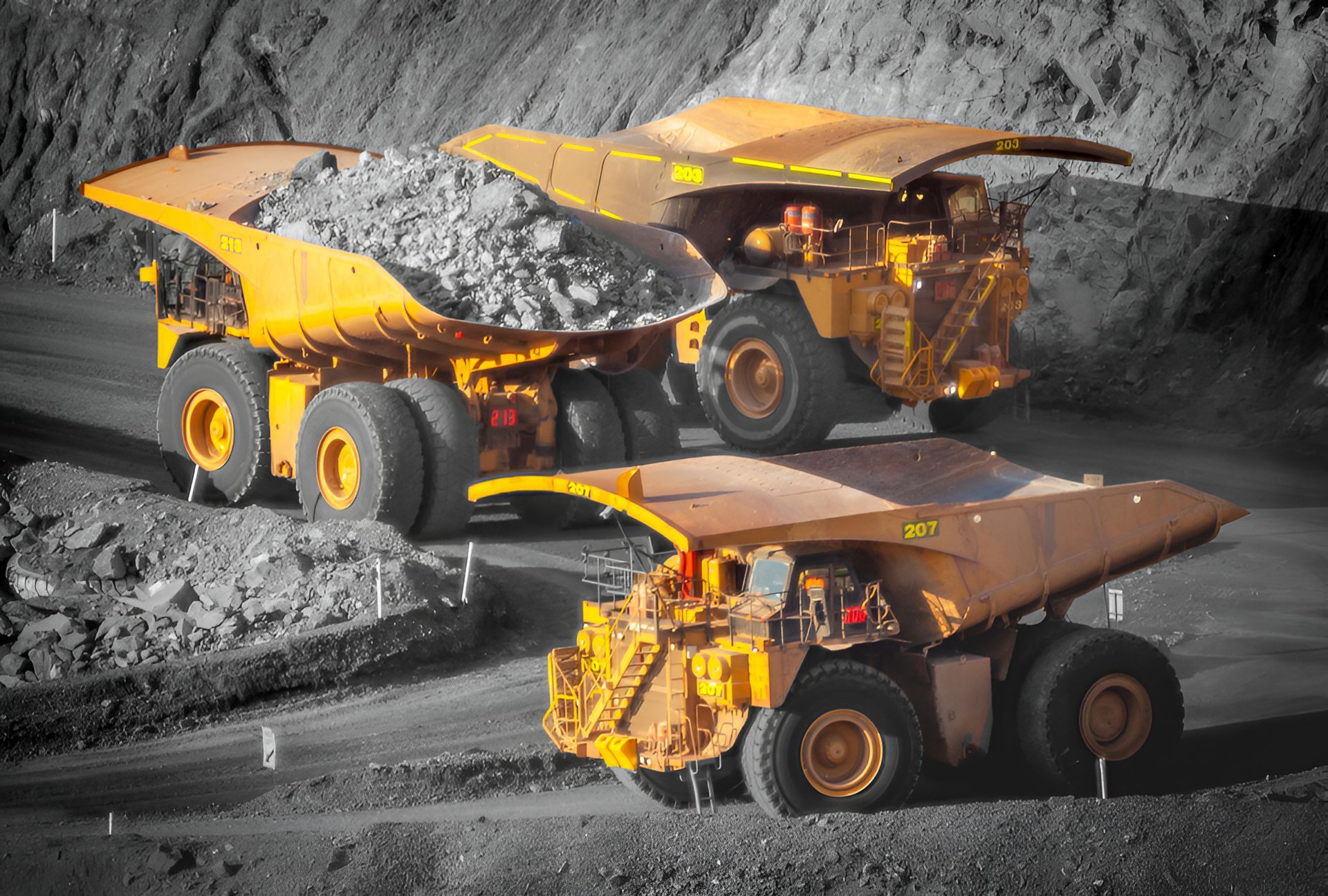 A Man Is Standing Next To A Machine That Is Digging — ACC Excavations & Demolition Pty Ltd In Oak Floats, NSW