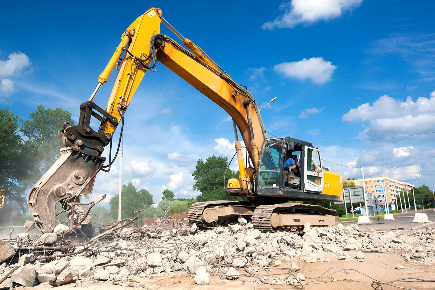 Yellow Excavator Demolishing Concrete