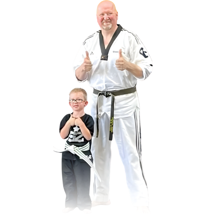 Man pointing, smiling, wearing black hoodie; arm tattoo visible.