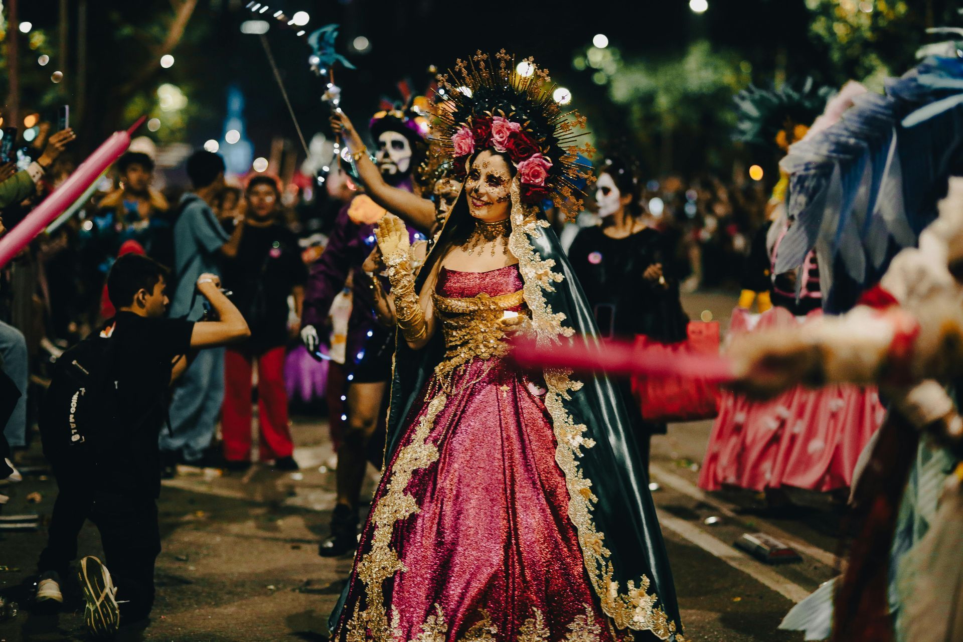 Interior of the Metropolitan Museum of Art with a large statue and people below, lit by a glass ceiling.