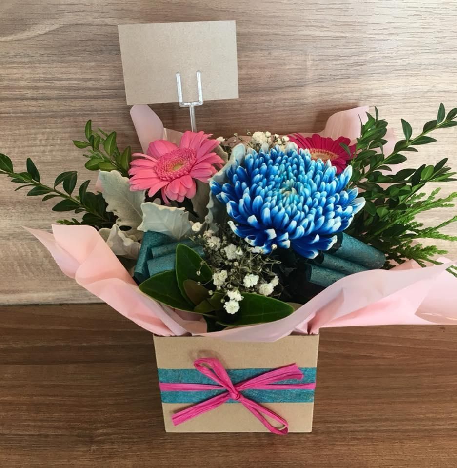 A Box of Flowers With a Pink and Blue Ribbon In The Box — Flower Hunt in Robina, QLD