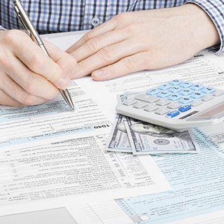 accountant filling out tax forms