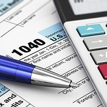 Income Tax Preparation- forms, pen, calculator