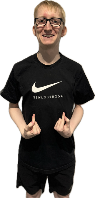 Man with glasses and a black Nike shirt gives thumbs up.