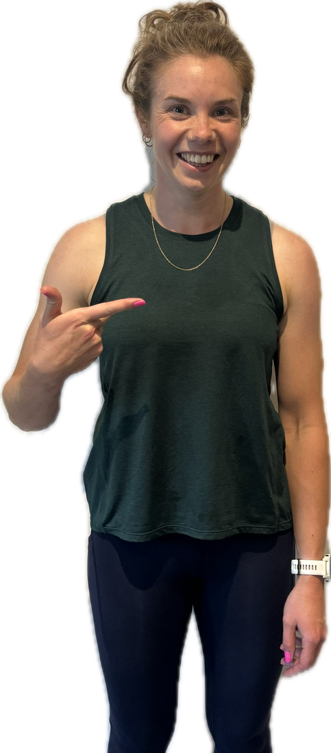 Woman in green top pointing at herself.