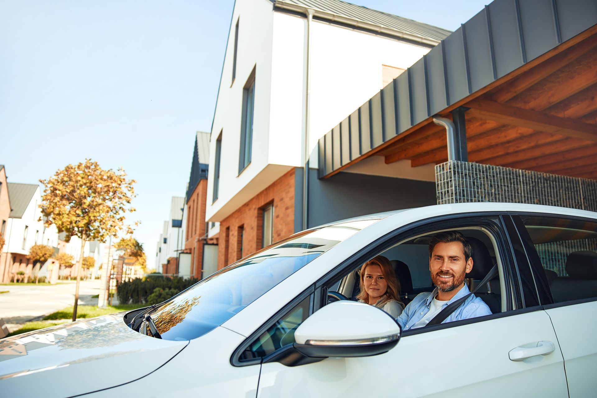 A man is giving a piece of paper and pen to a woman.