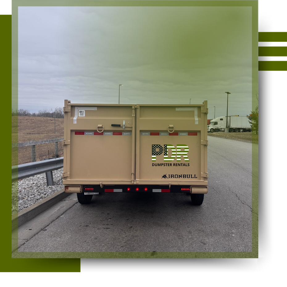 A PDR Dumpster truck parked on the road