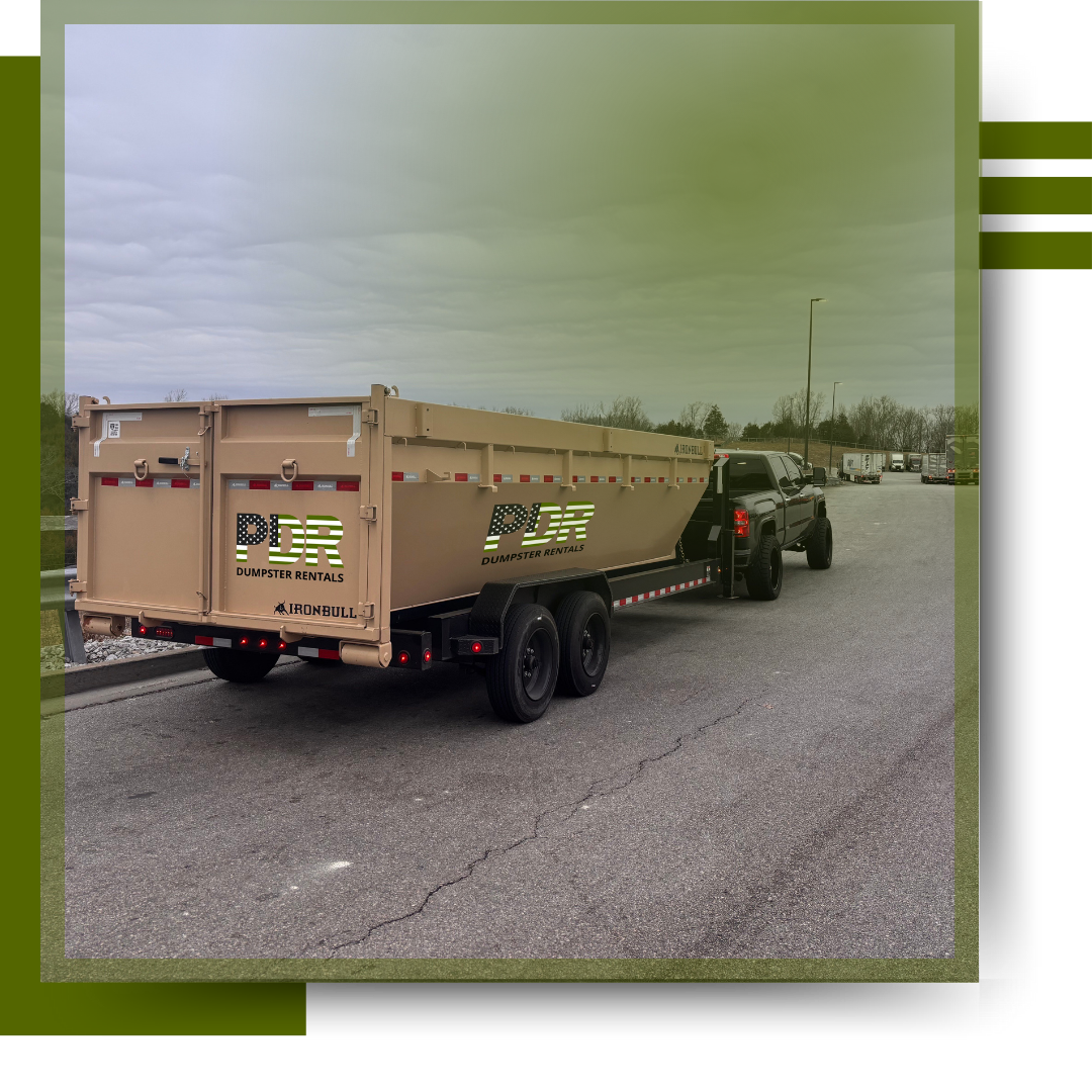 A PDR Dumpster truck parked on the road