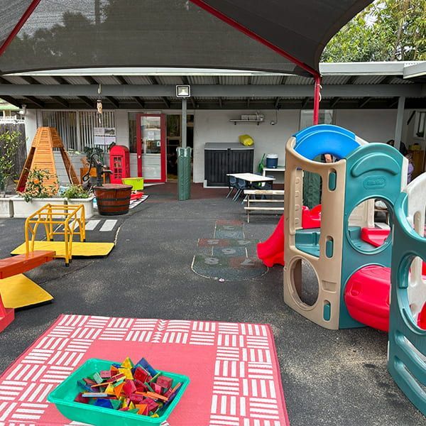 A Children's Playground With a Green Tray of Blocks on the Floor — Mt Ousley Pre School in Fairy Meadow, NSW