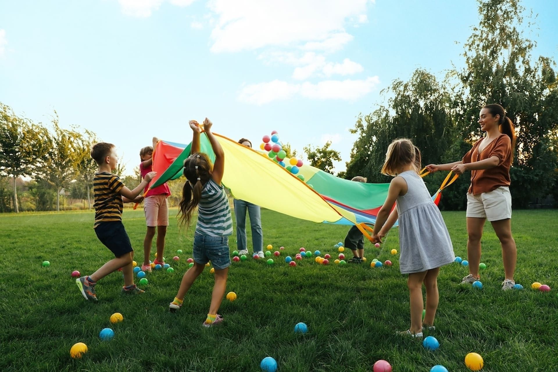 Kids Playing on the Grass — Mt Ousley Pre School in Fairy Meadow, NSW