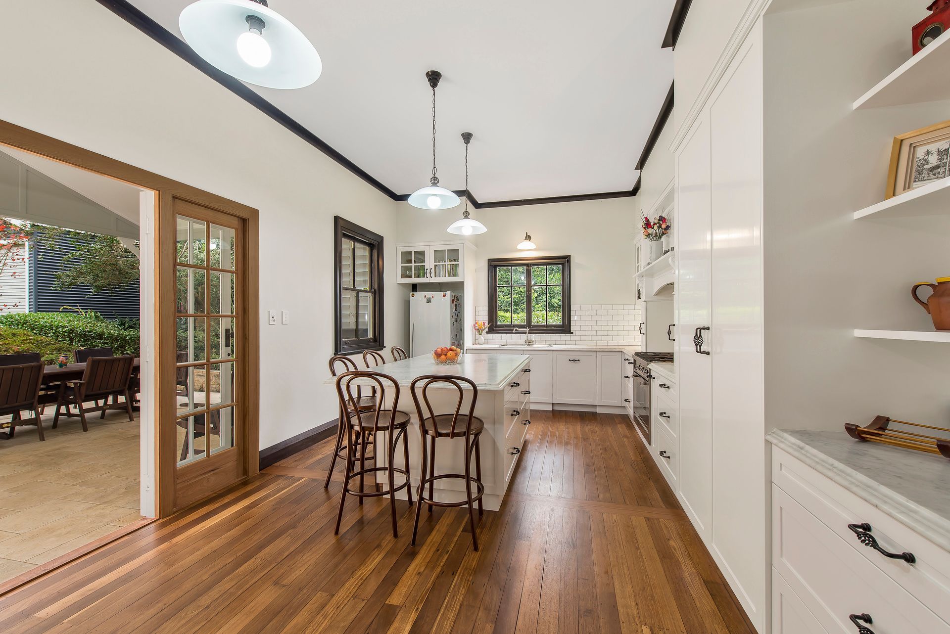 Minimalist Kitchen Joinery in White With Warm Wood Accents — Plumbe Joinery in Coffs Harbour, NSW