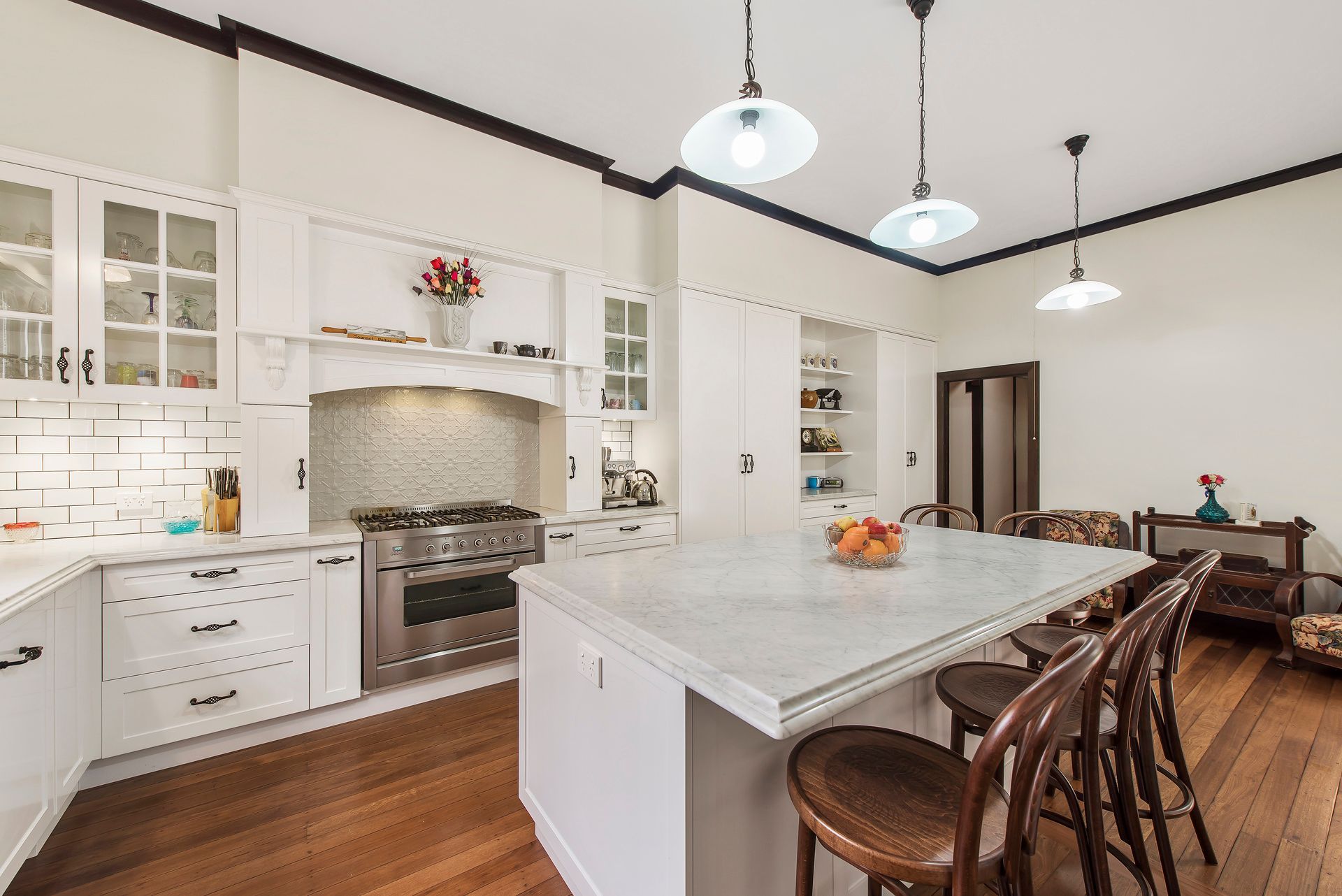 A Kitchen With White Cabinets , and  Wooden Floors — Plumbe Joinery in Coffs Harbour, NSW