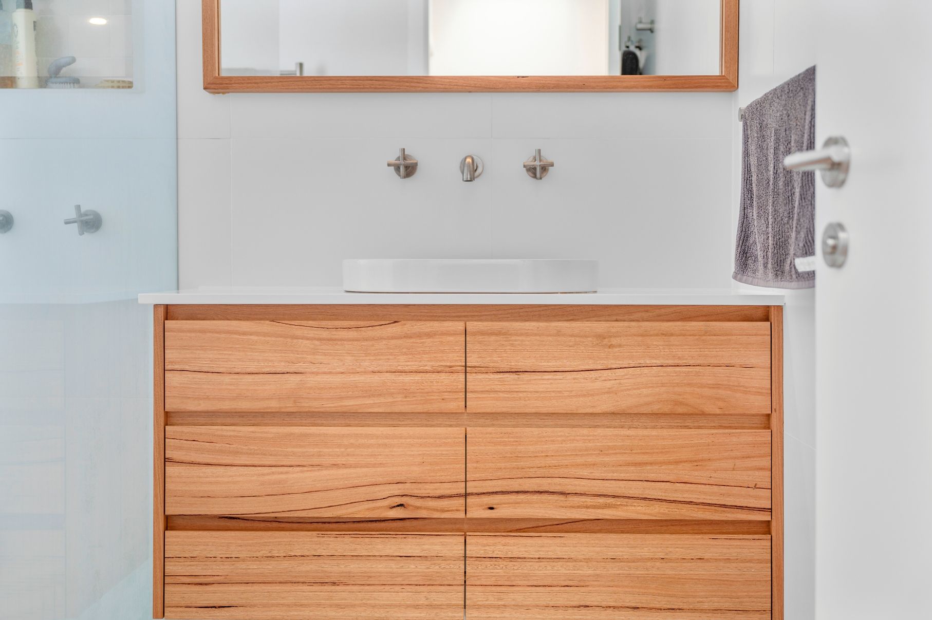A Bathroom With a Wooden Cabinet — Plumbe Joinery in Coffs Harbour, NSW