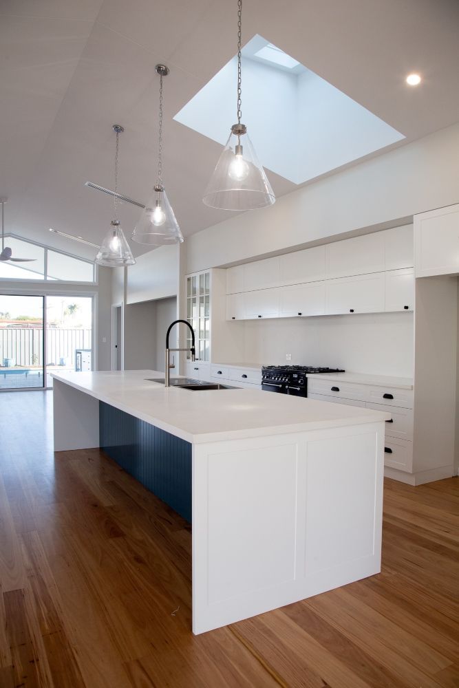 A Living Room With A White Table And Sink — Plumbe Joinery in Coffs Harbour, NSW