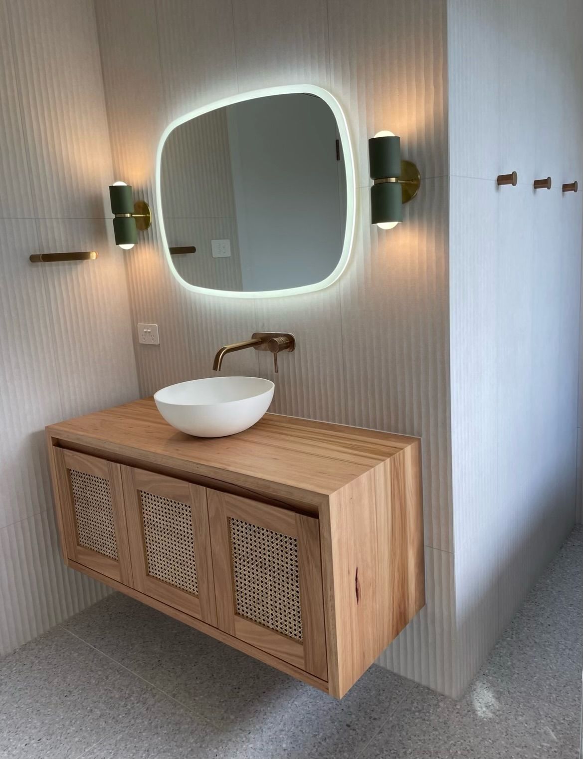 A Bathroom With a Sink and a Mirror on the Wall — Plumbe Joinery in Coffs Harbour, NSW