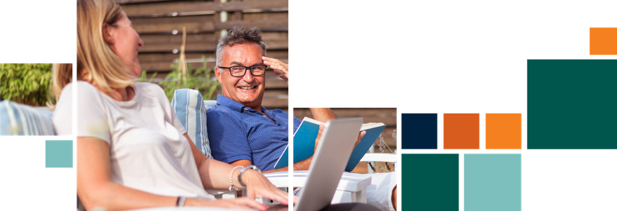 A man and a woman are sitting at a table with a laptop.