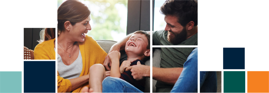 A man and a woman are sitting on a couch with a child.