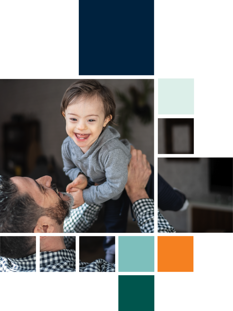 A man is holding a baby in his arms.