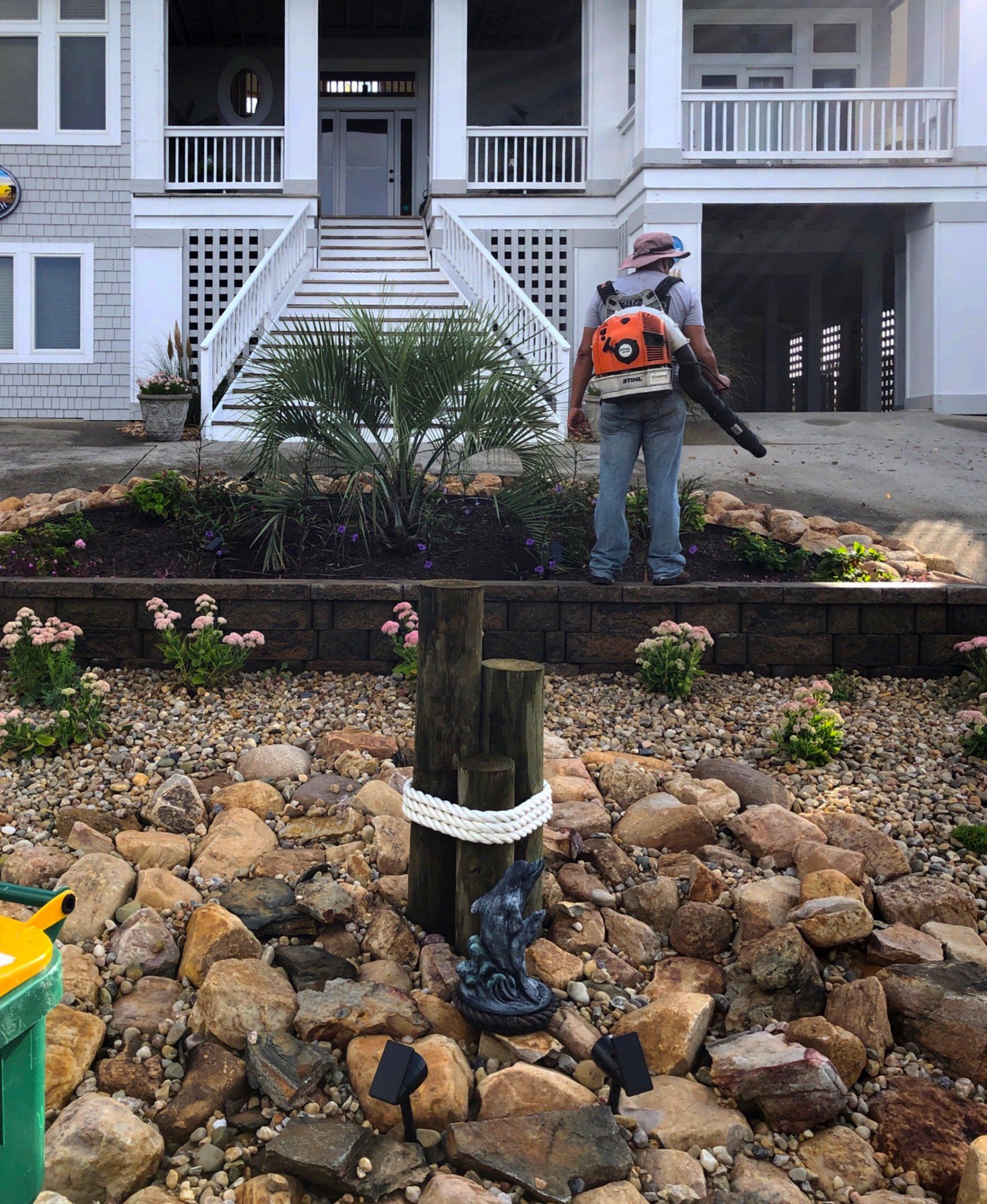 Retaining wall with garden bed above and below the wall.