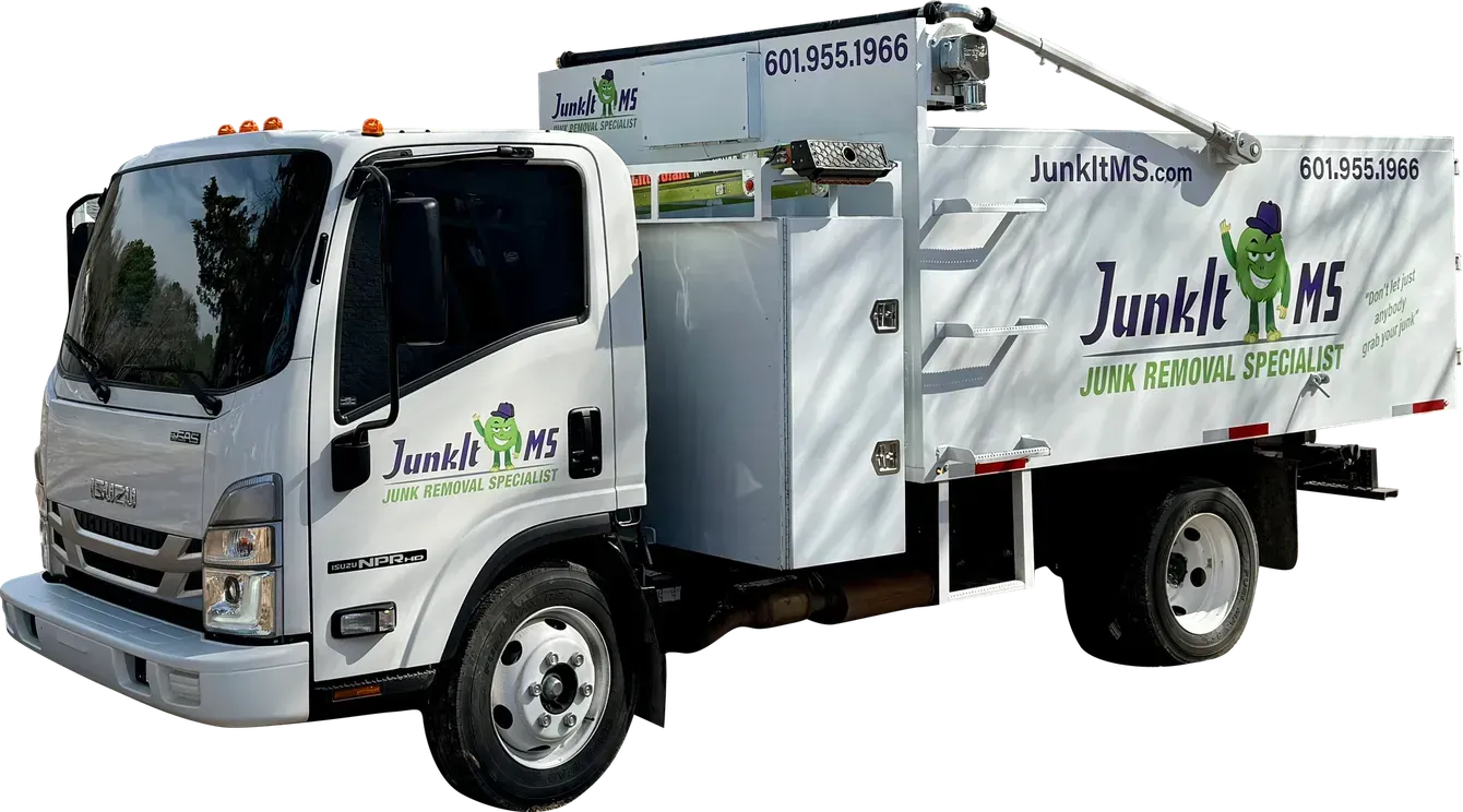 White Junk It 195 truck with a green logo and a trash can, parked outside.