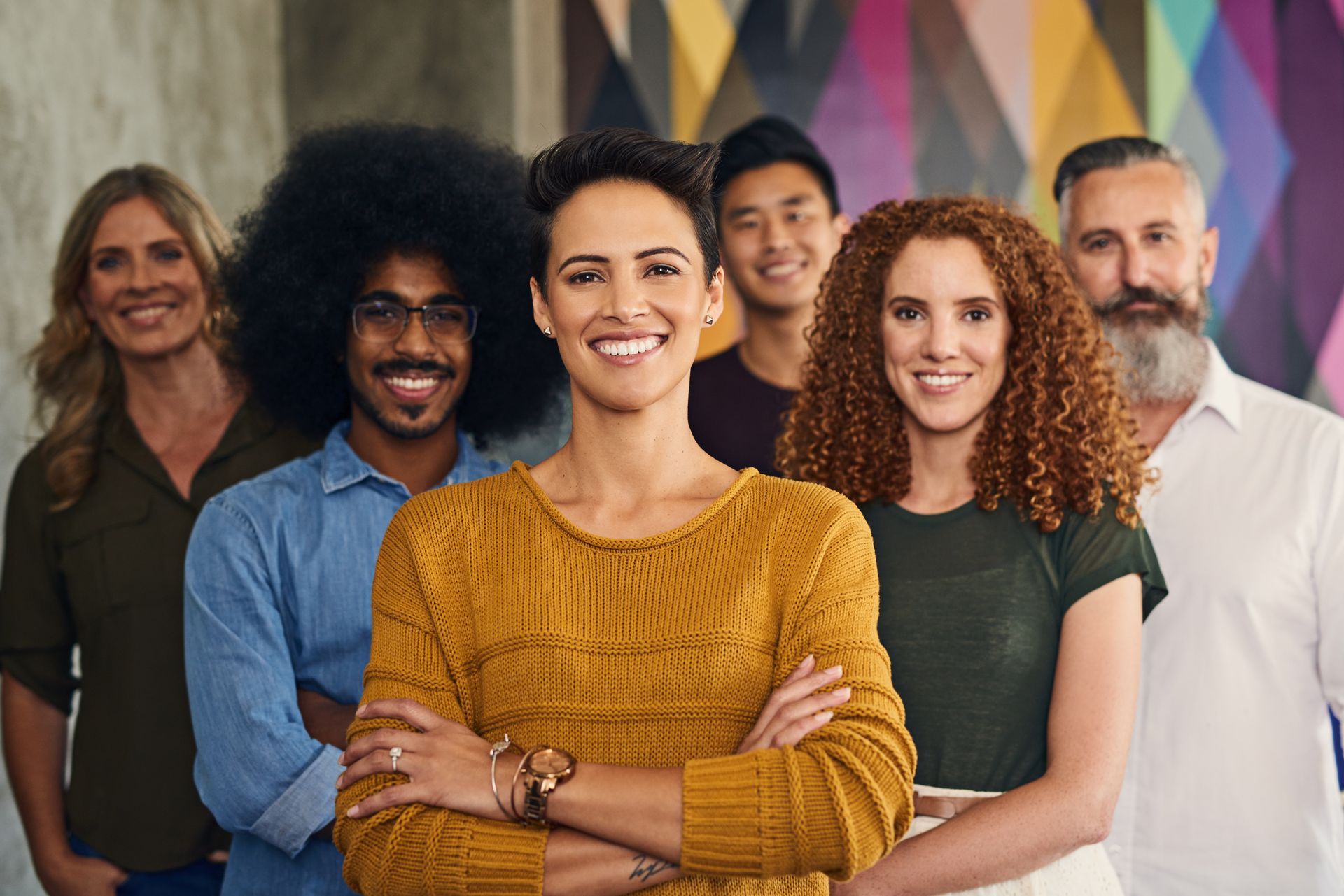A group of people are posing for a picture together.