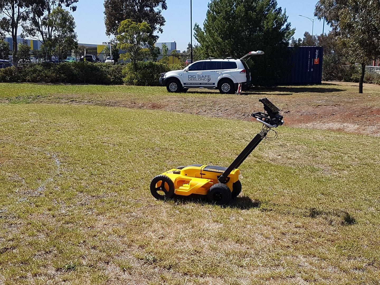 A yellow GPR on grass.