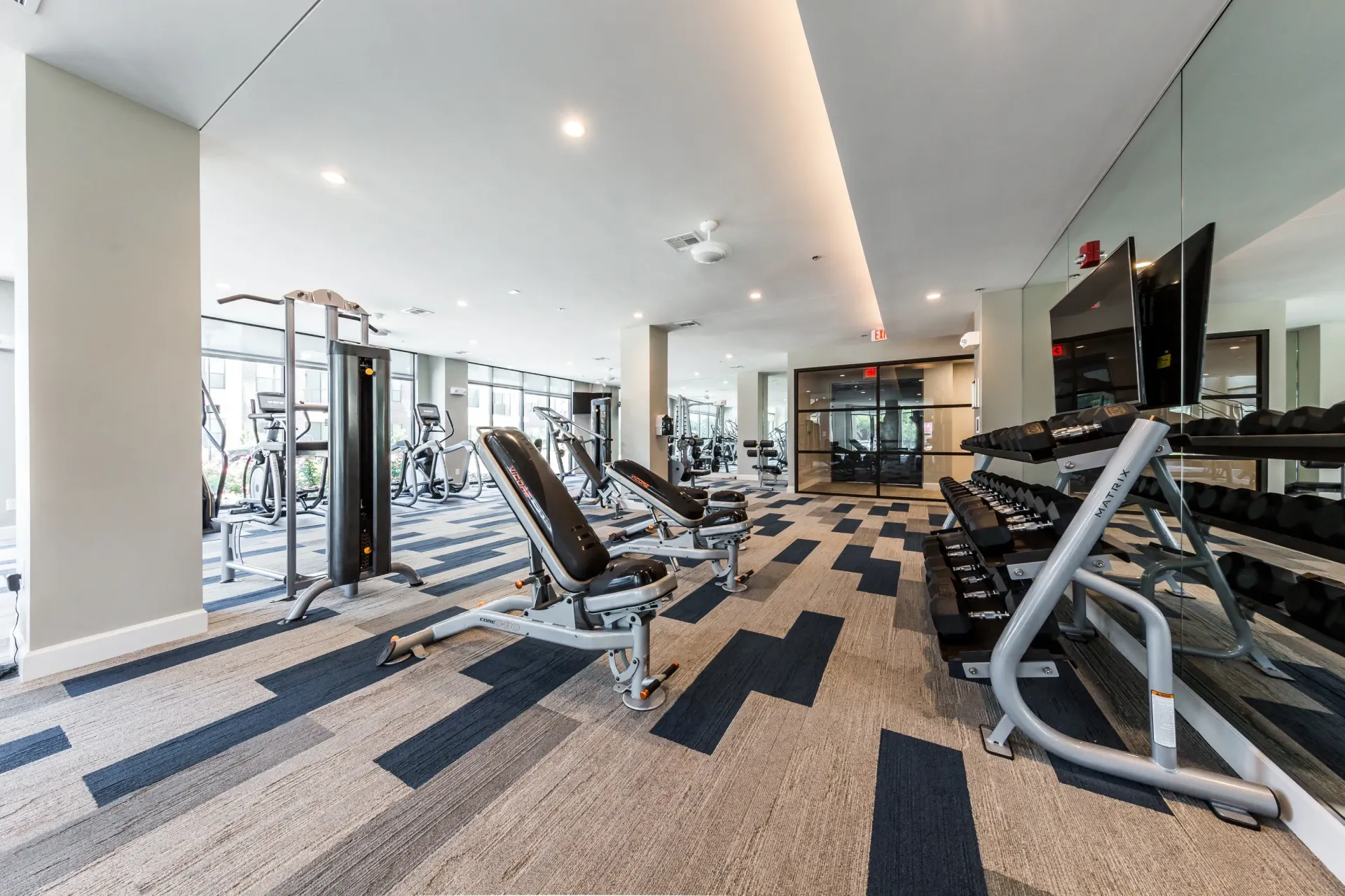 Weight room with free weights and cardio machines