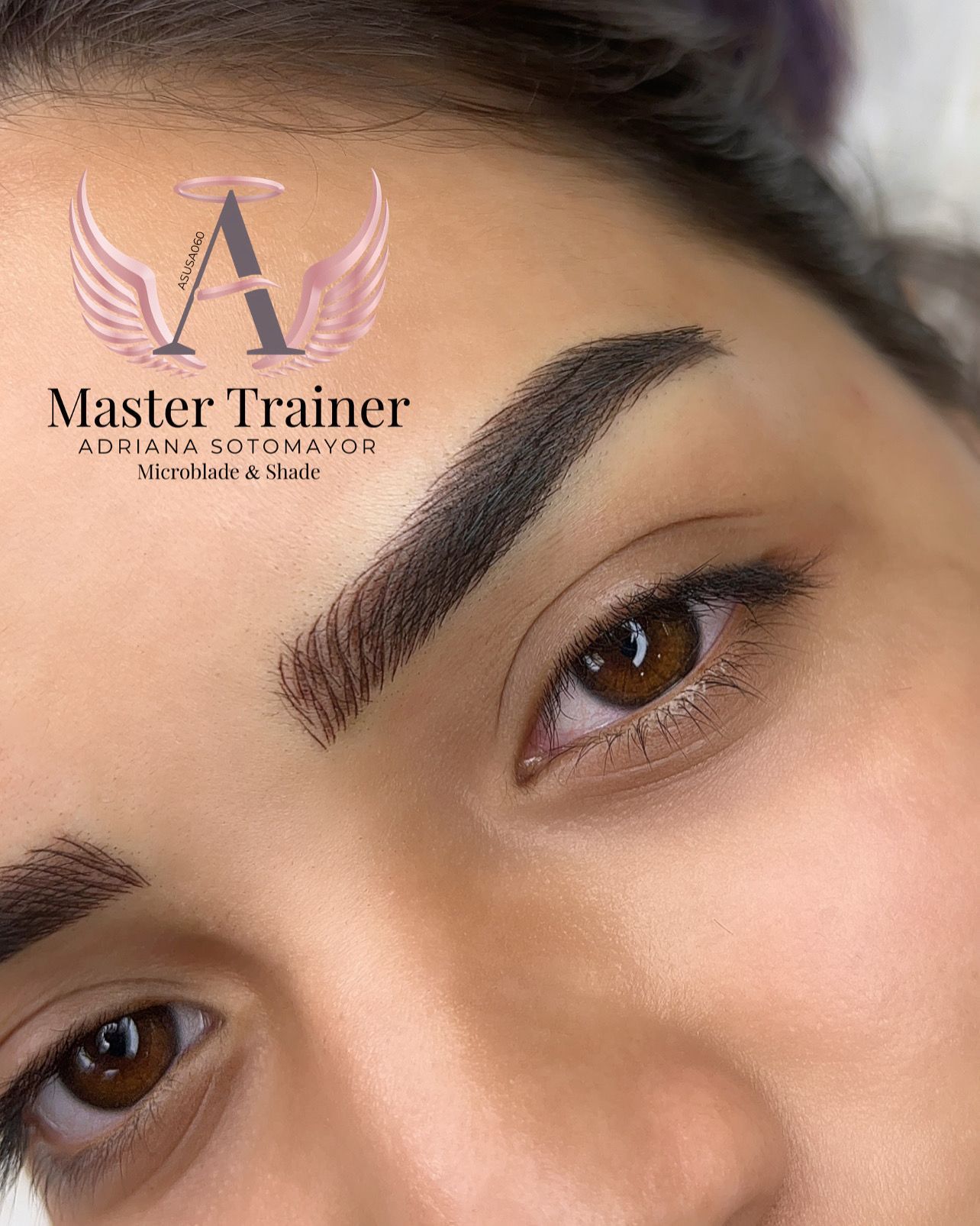 Close-up of a person with newly microbladed eyebrows and brown eyes.