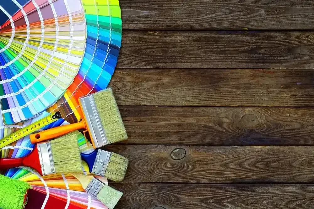 Color Swatches, Paintbrushes, and Tape Measure on a Wooden Surface — Jamie Frankham Painting in Goonellabah, NSW