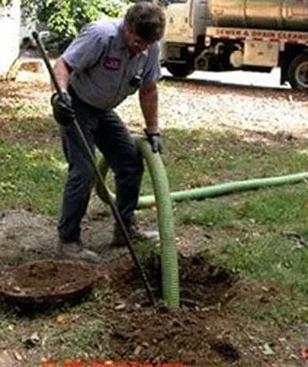 Man Holding Septic Hose — Tully, NY — Northrup Septic Service