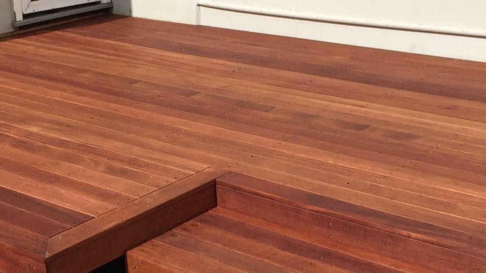 A close up of a wooden counter top in a kitchen.