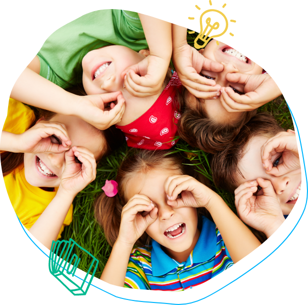 children laughing and playing in a circle with their hands around their eyes