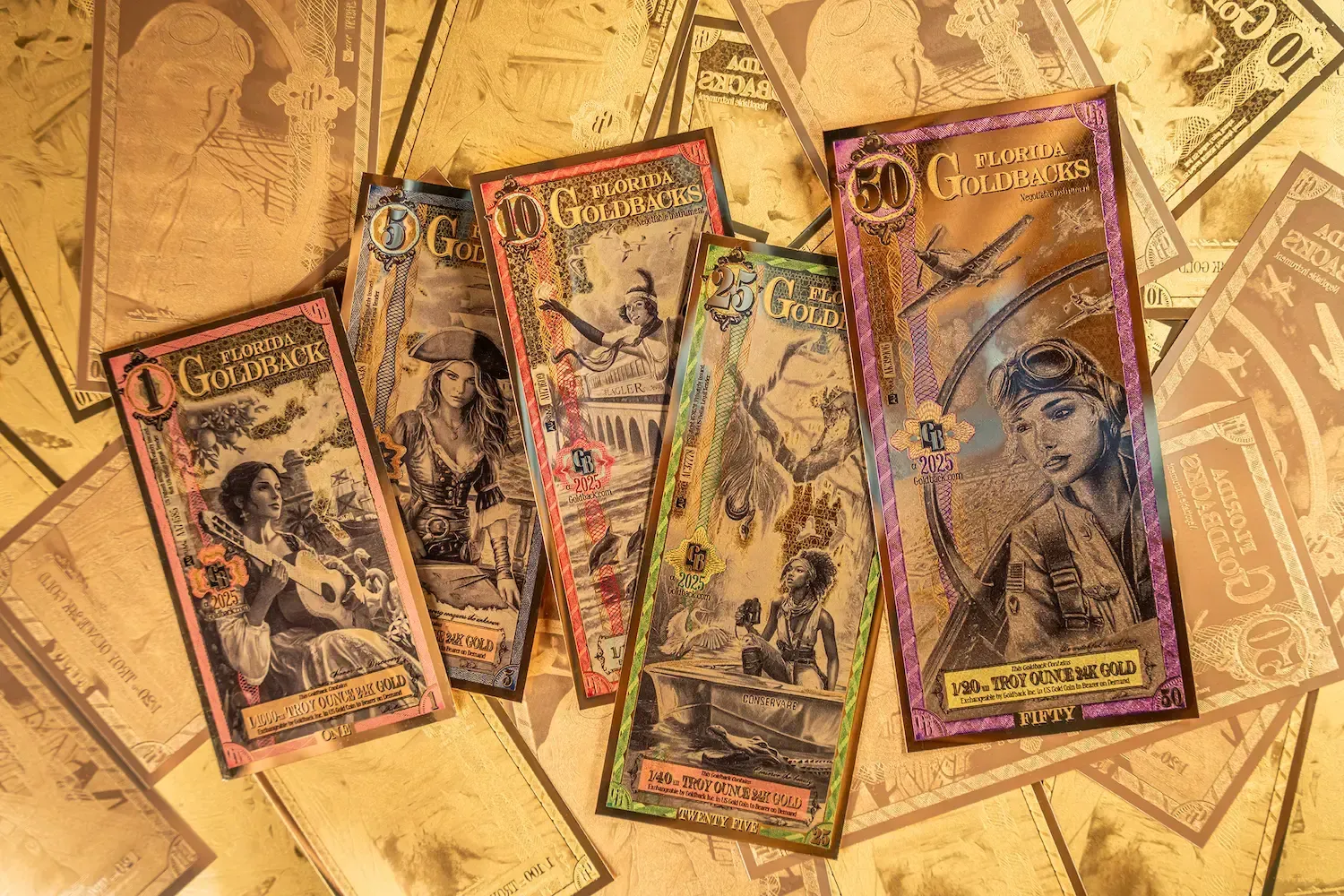 Five ornate, colorful play money bills on a gold-colored background.