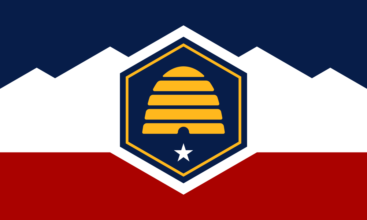 Utah state flag featuring a gold beehive emblem on a blue and white mountain background, with blue and red stripes.