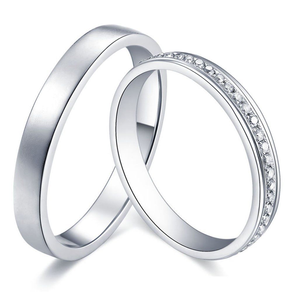 Two silver wedding rings: one plain, one with small diamonds.