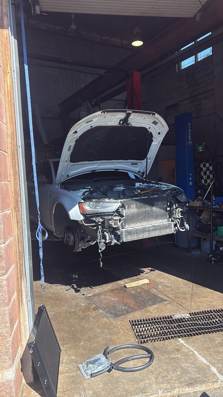 Auto Repair Shop Bay With Vehicle Undergoing Diagnostics | Delta Auto Repair