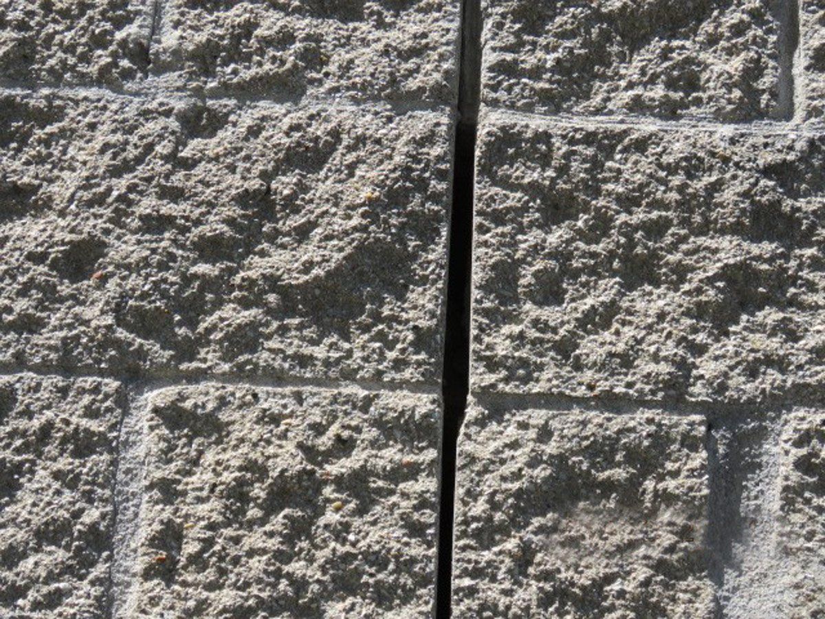 Stone wall showing a wide gap between stones in the joint
