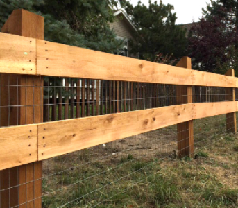 2 board and post fence installed in Cheyenne