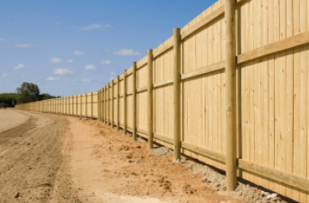 Wood fence installed in Cheyenne on new construction site in Cheyenne