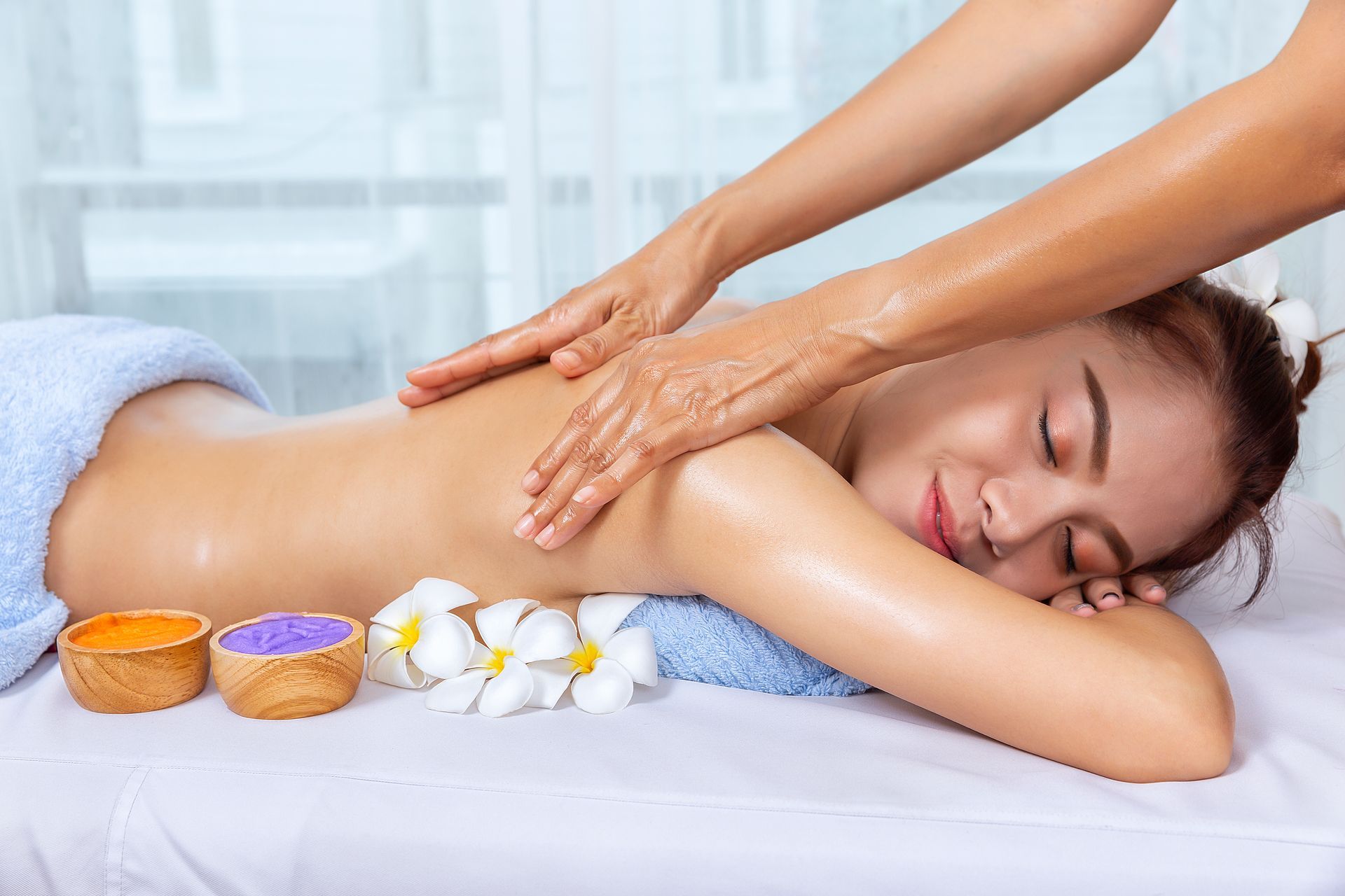 A woman is getting a massage at a spa.