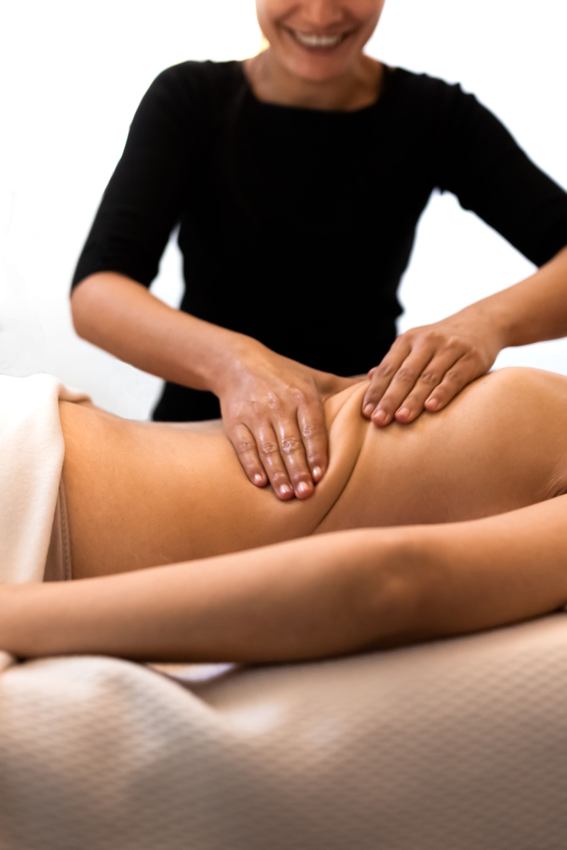woman lying on the table getting a massage