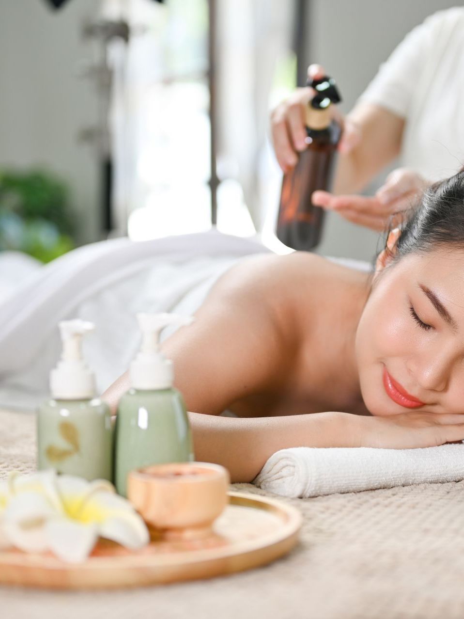 a woman is getting a massage at a spa
