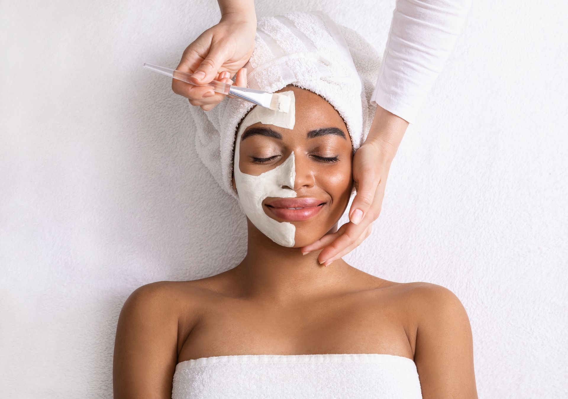 woman making facial treatment